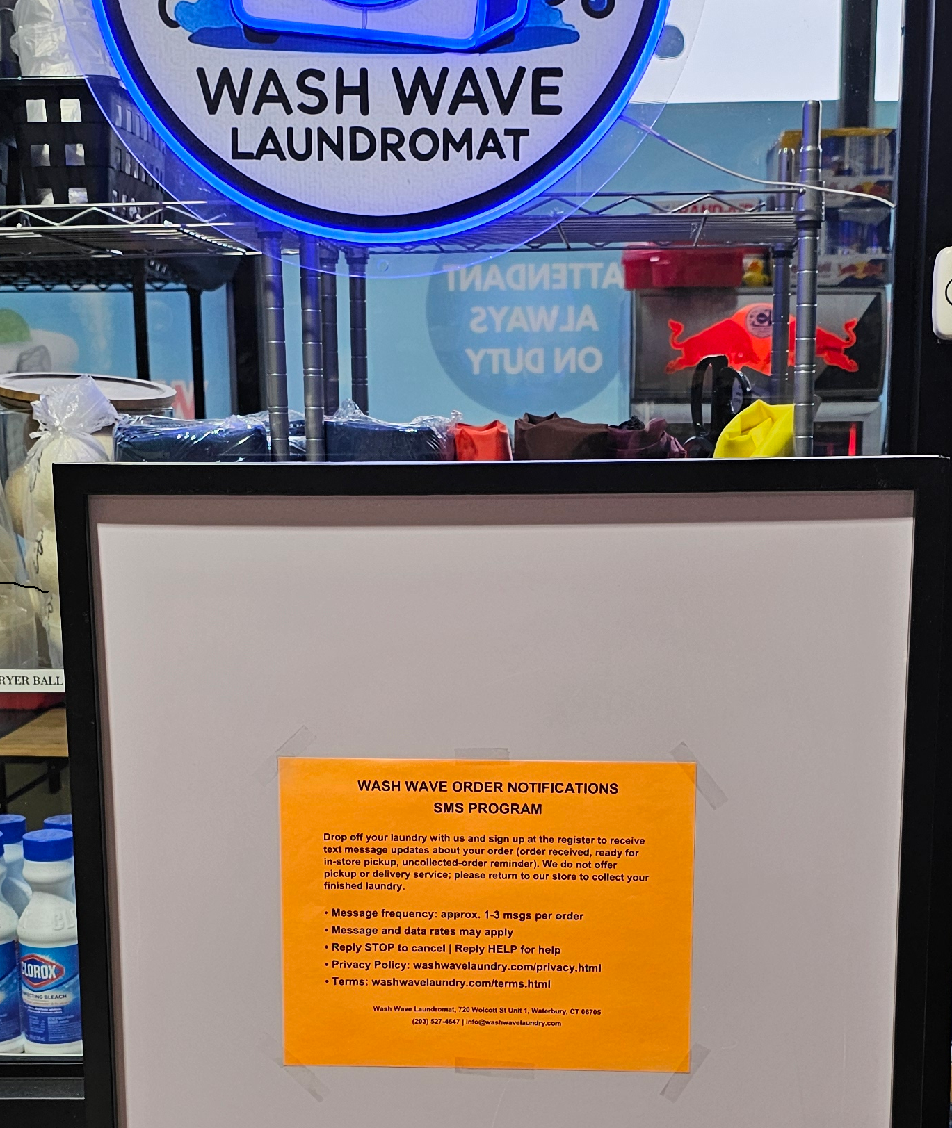 Wash Wave in-store SMS opt-in sign at the register